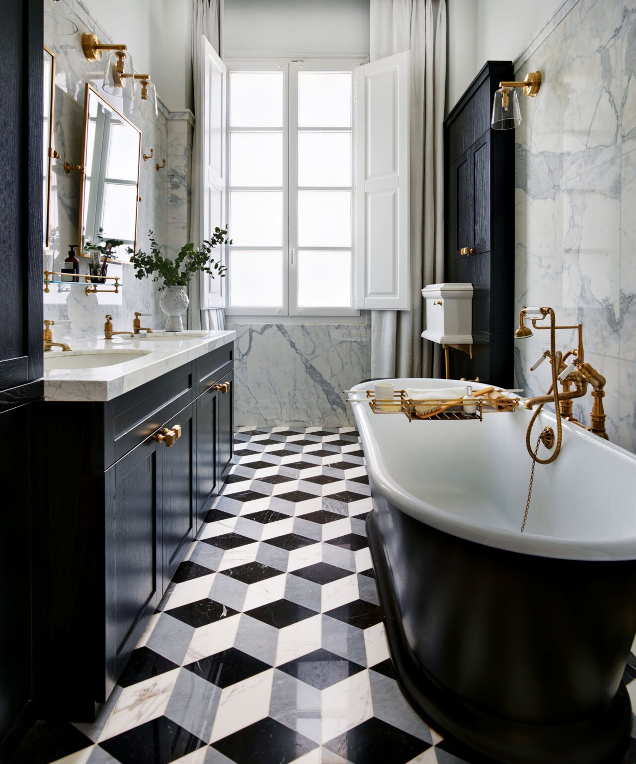 Bathroom with black vanity, white sink, black and white tile floor